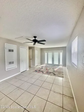 a view of an empty room and window