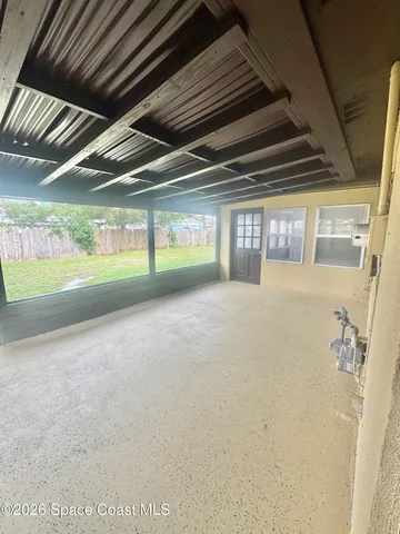 a view of a large body of water with a building in the background