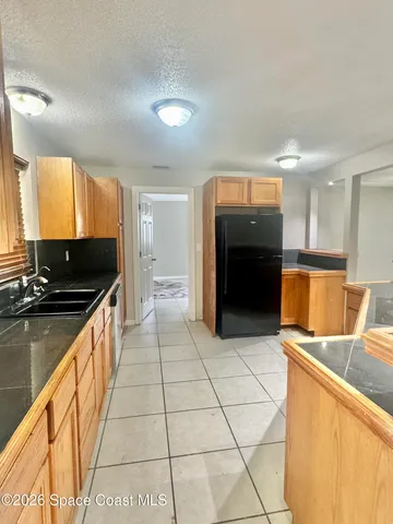 a kitchen with stainless steel appliances granite countertop a stove and a sink