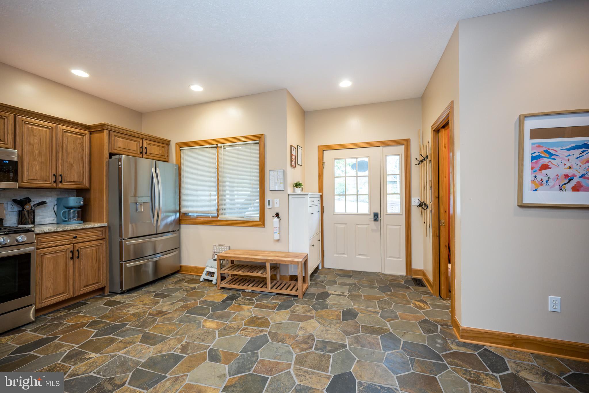 147 Marsh Hill Road McHenry, MD 21541 - Photo 11 of 60 a kitchen with sink cabinets and refrigerator