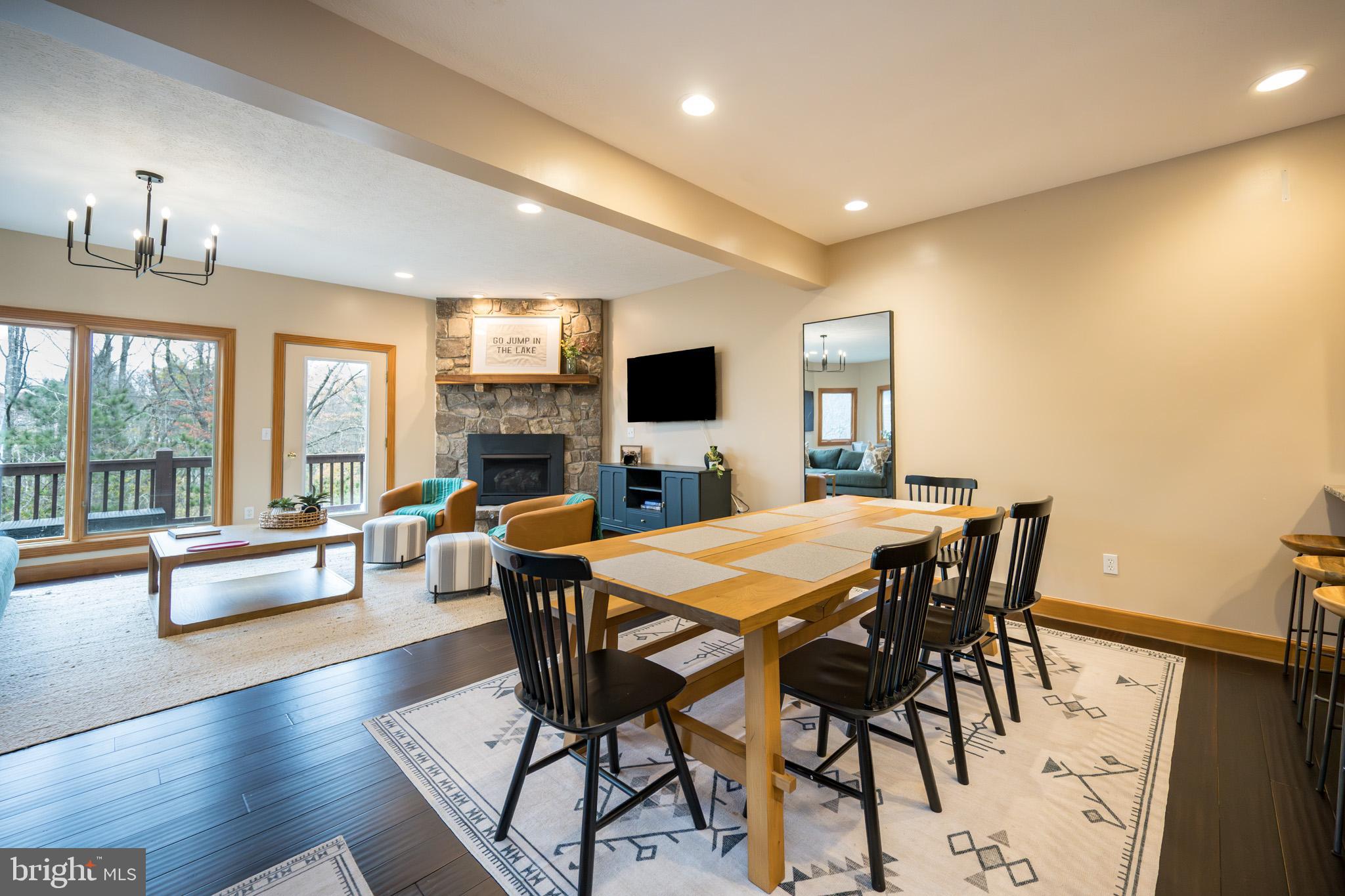 147 Marsh Hill Road McHenry, MD 21541 - Photo 13 of 60 a view of a dining room with furniture window and wooden floor