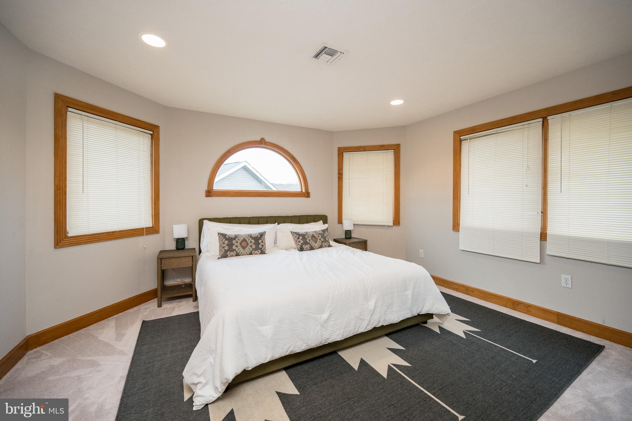 147 Marsh Hill Road McHenry, MD 21541 - Photo 27 of 60 a bedroom with a bed and a large window