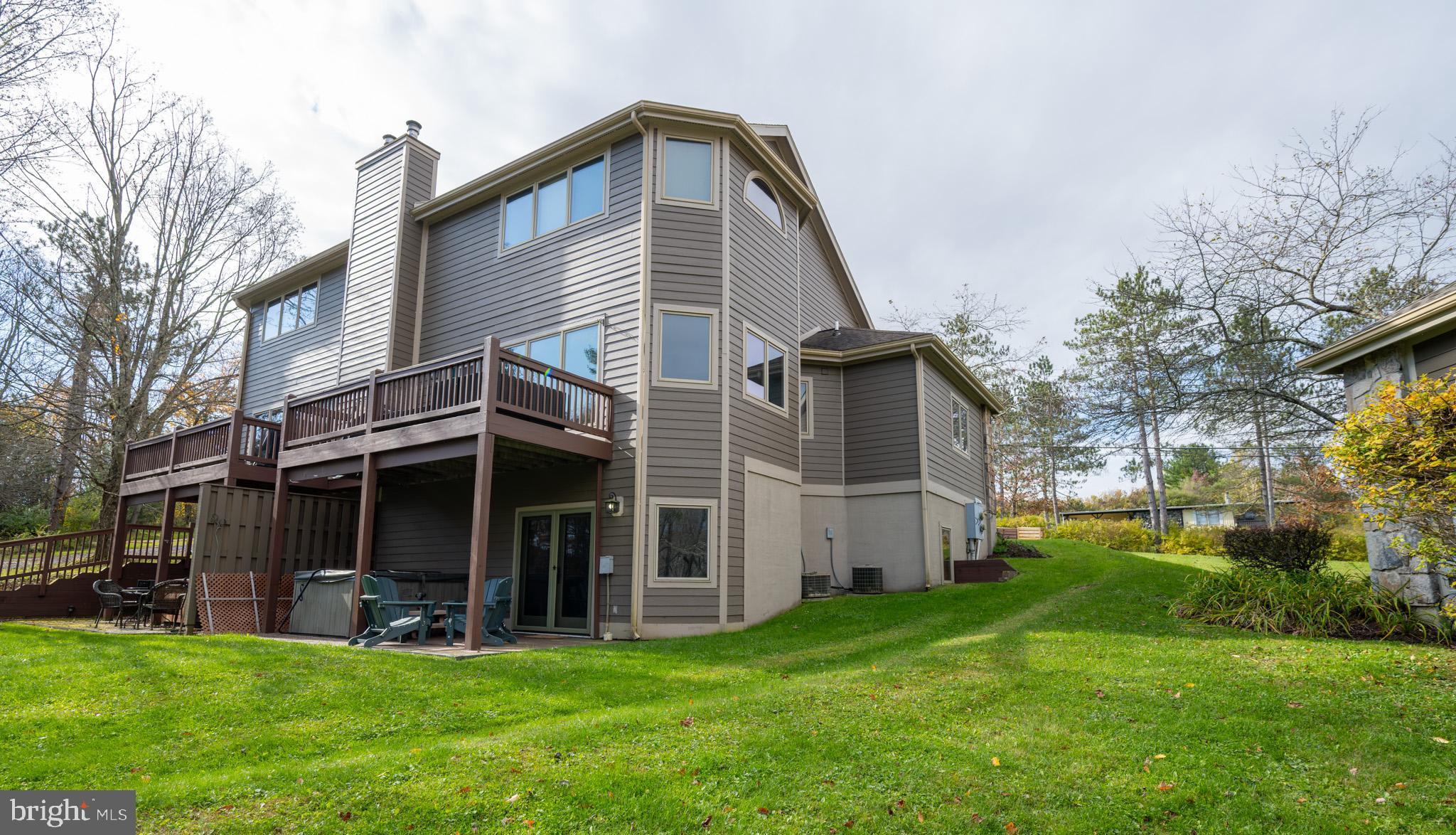147 Marsh Hill Road McHenry, MD 21541 - Photo 3 of 60 a view of a house with a yard and a large tree