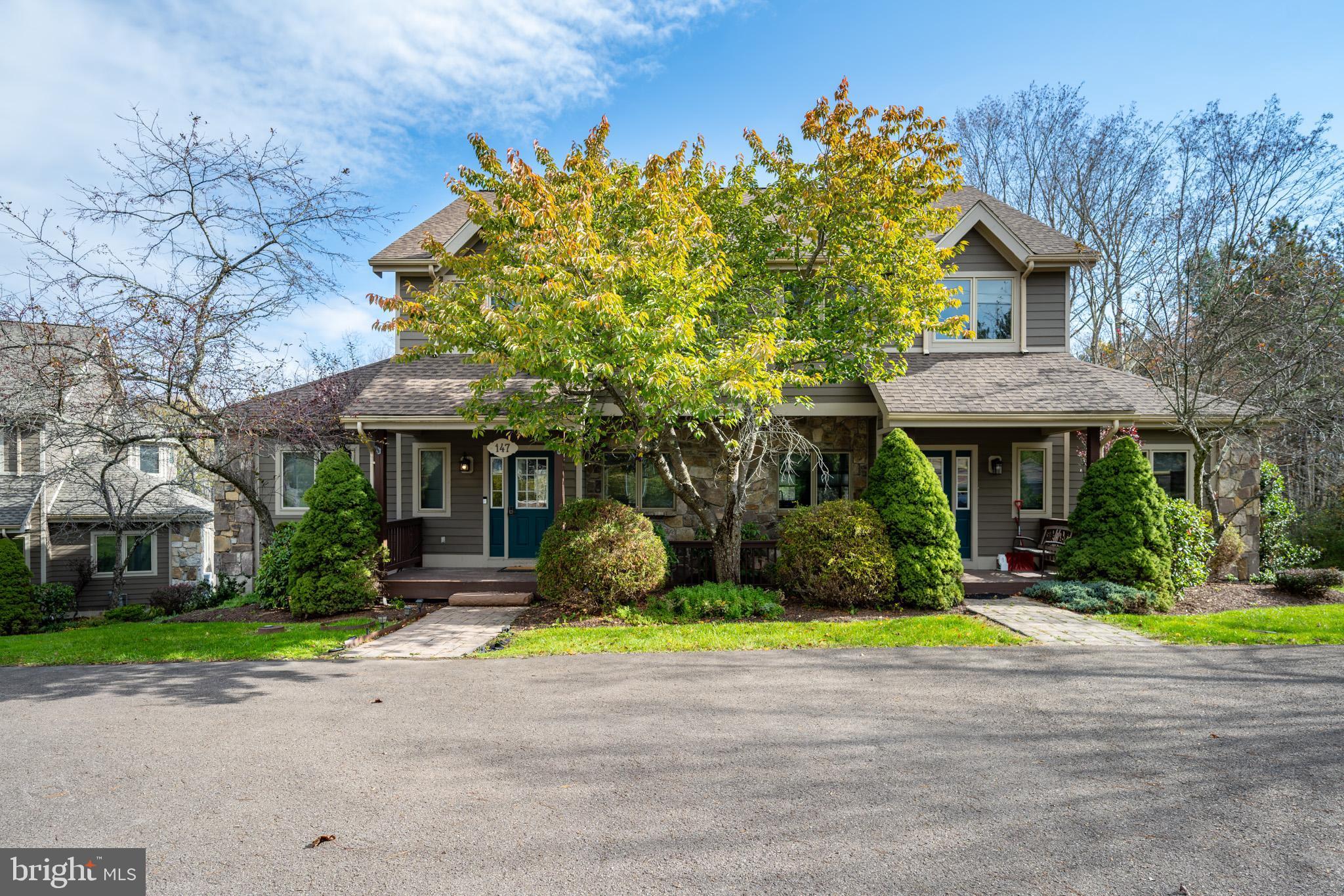 147 Marsh Hill Road McHenry, MD 21541 - Photo 4 of 60 a front view of a house with a yard and large trees