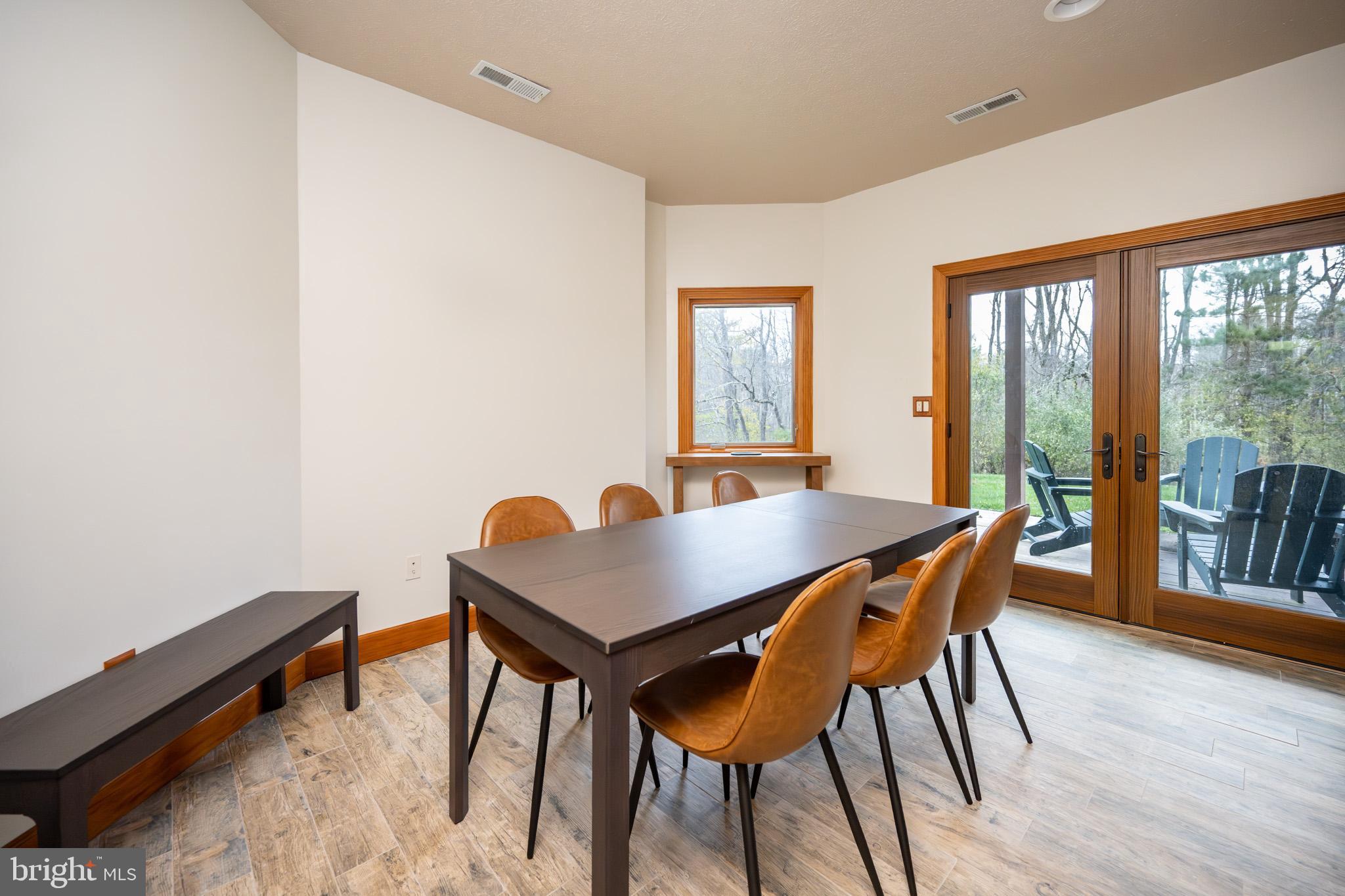 147 Marsh Hill Road McHenry, MD 21541 - Photo 43 of 60 a view of a dining room with furniture and wooden floor