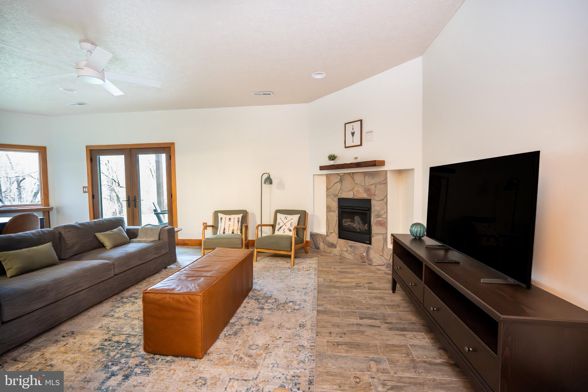 147 Marsh Hill Road McHenry, MD 21541 - Photo 44 of 60 a living room with fireplace furniture and a flat screen tv