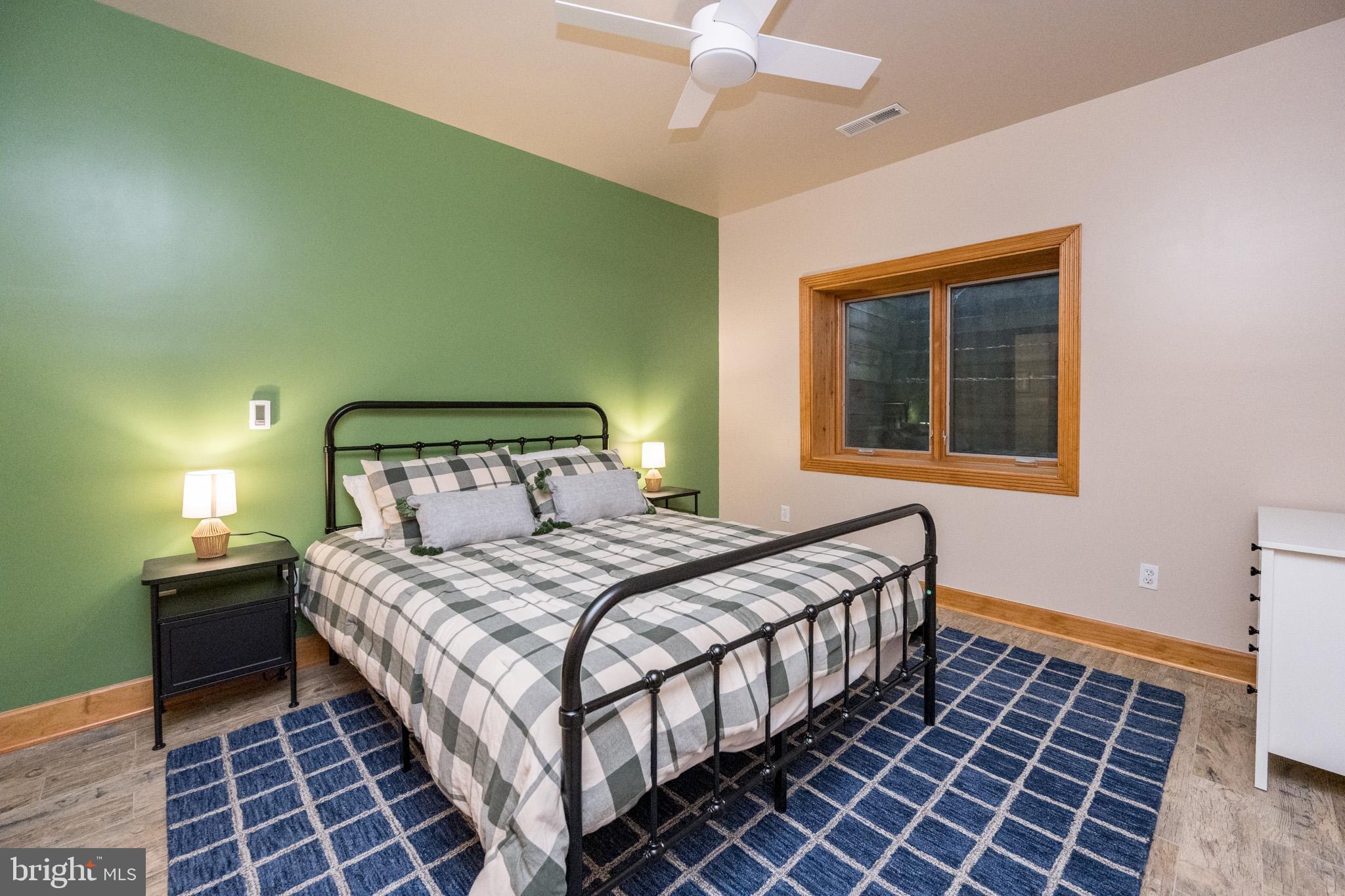 147 Marsh Hill Road McHenry, MD 21541 - Photo 46 of 60 a bedroom with a bed and a window