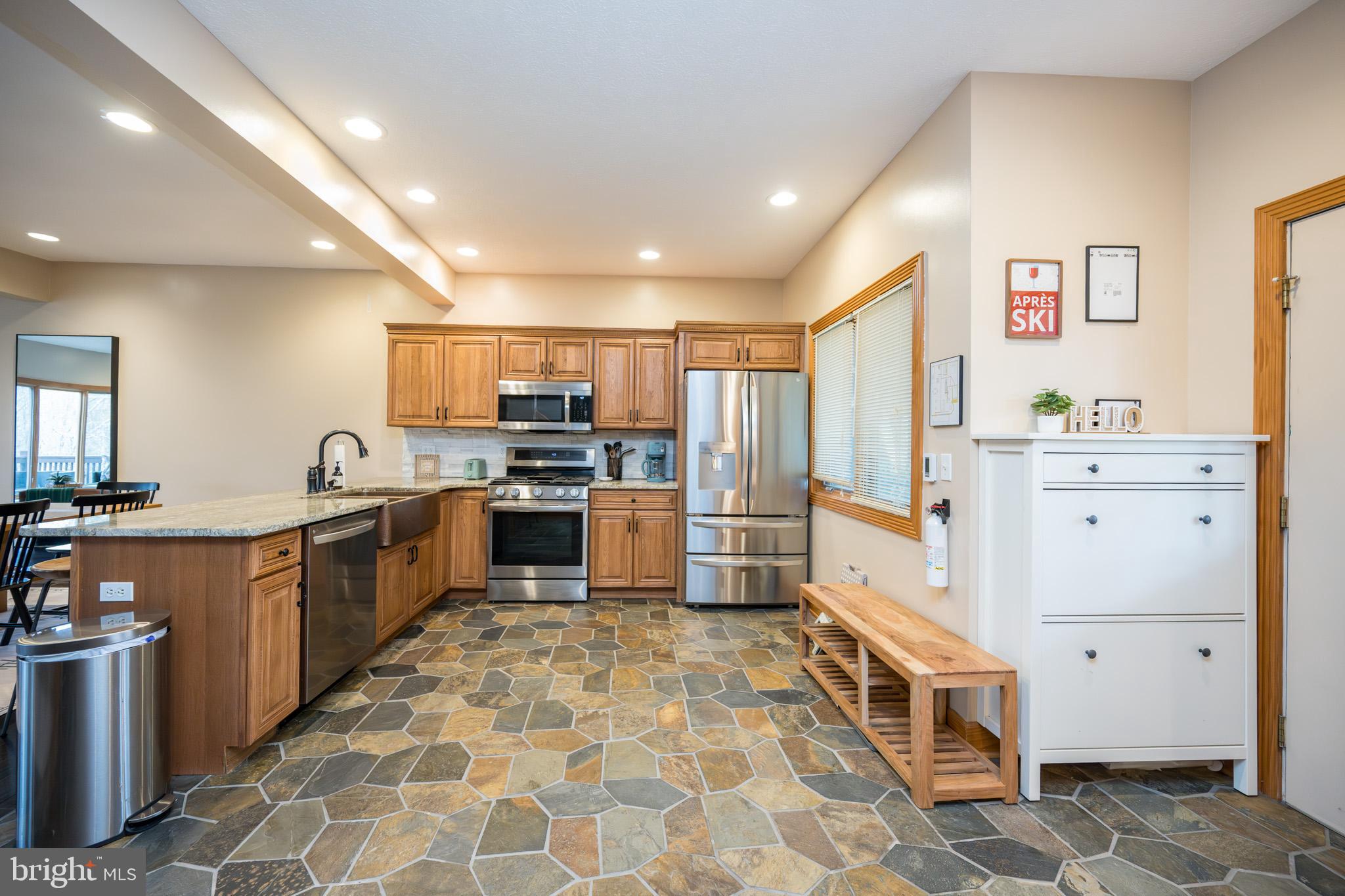 147 Marsh Hill Road McHenry, MD 21541 - Photo 5 of 60 a large kitchen with stainless steel appliances granite countertop a sink and cabinets