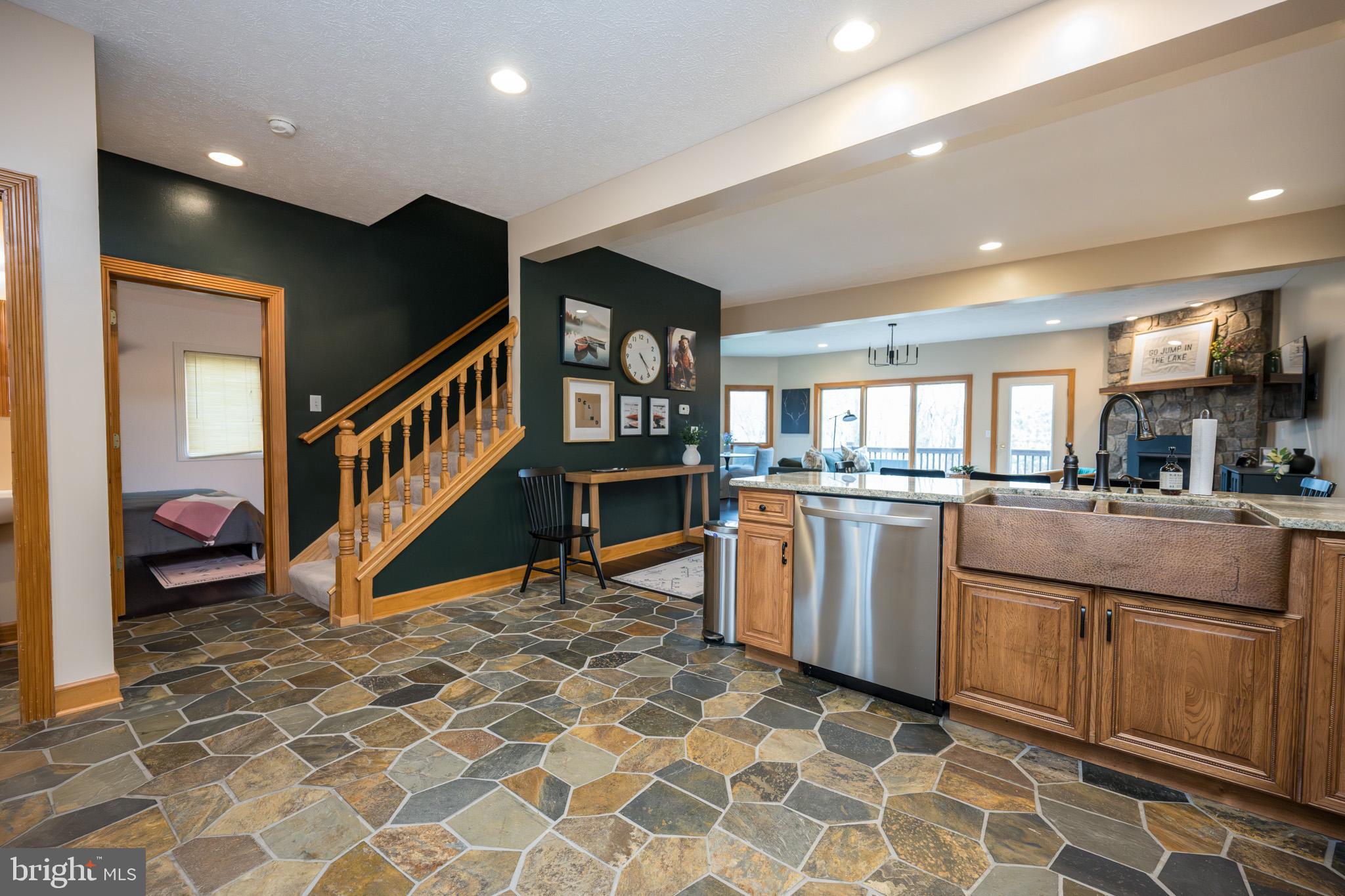 147 Marsh Hill Road McHenry, MD 21541 - Photo 7 of 60 a kitchen with stainless steel appliances granite countertop a refrigerator and a sink