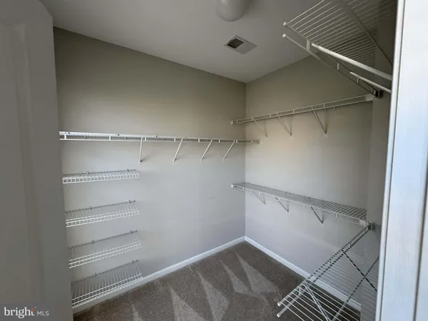 a view of a room with racks on the wall