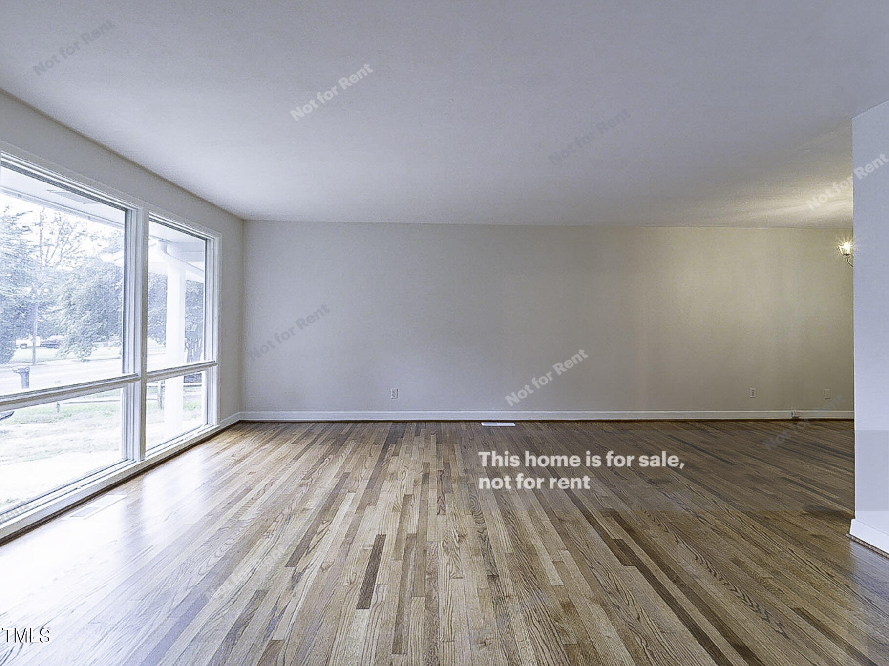 3413 Wade Avenue Raleigh, NC 27607 - Photo 13 of 24 a view of an empty room and wooden floor and a window