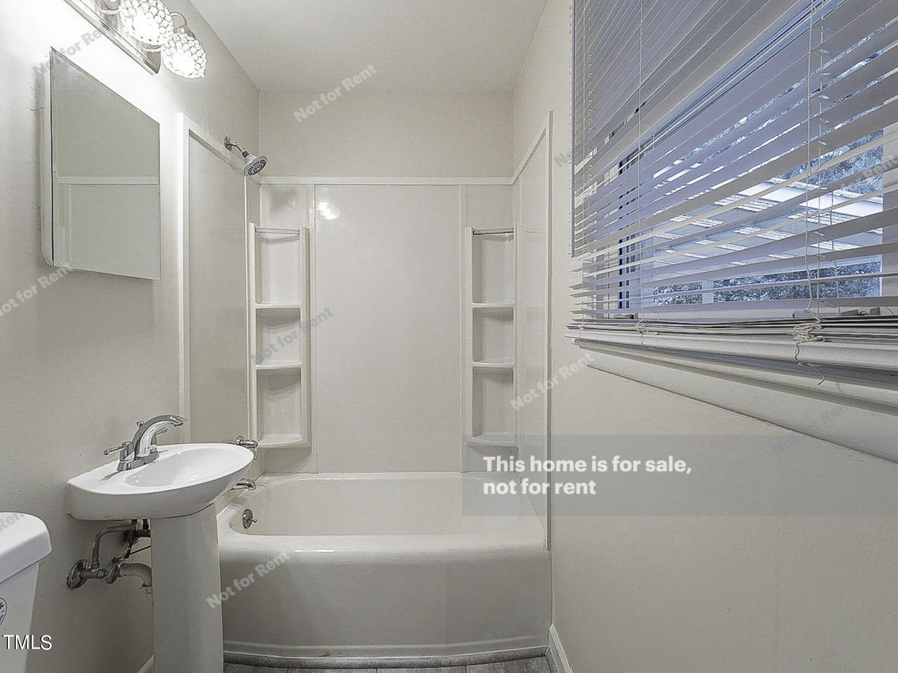 3413 Wade Avenue Raleigh, NC 27607 - Photo 19 of 24 a bathroom with a sink and a bathtub