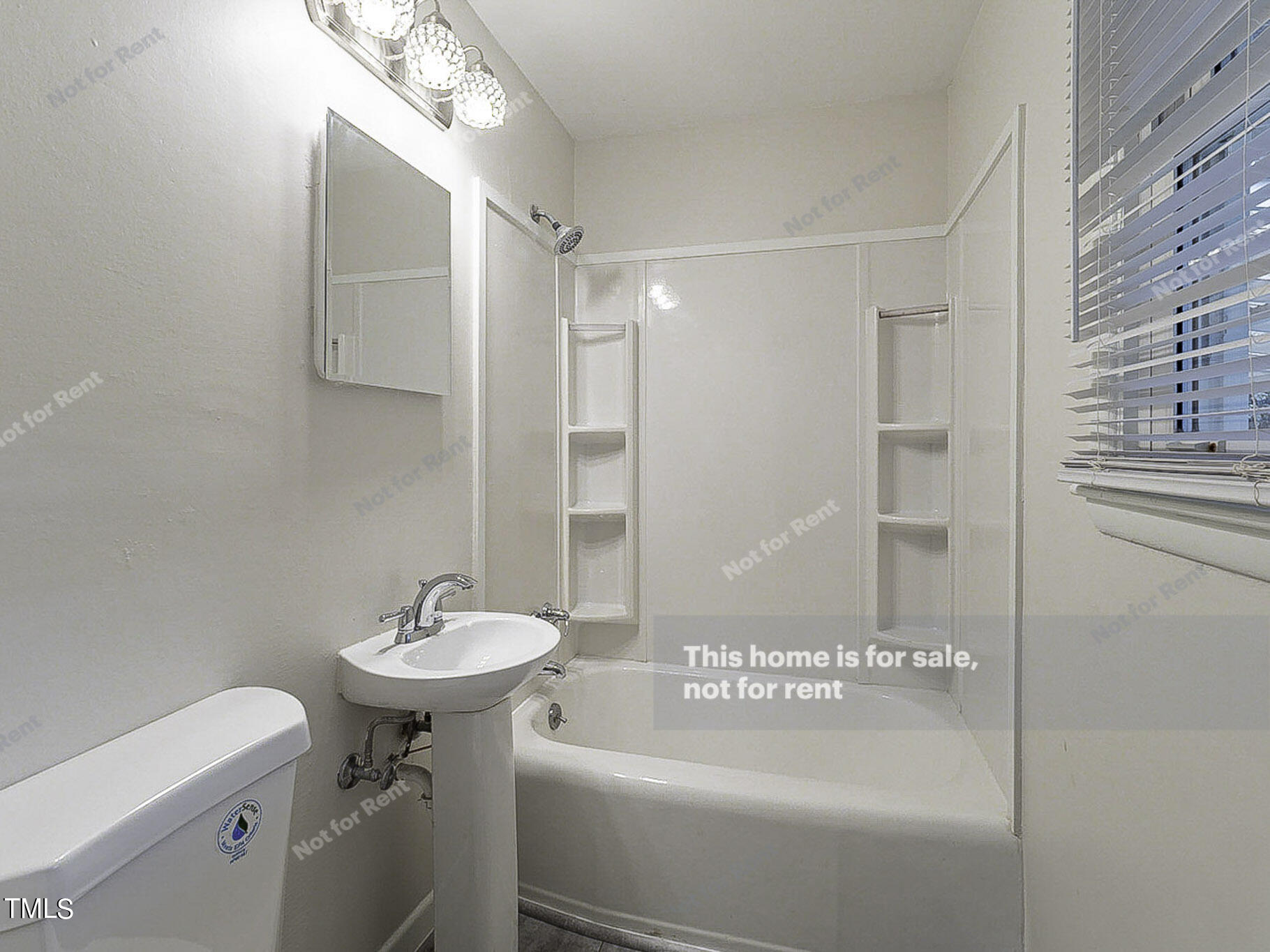 3413 Wade Avenue Raleigh, NC 27607 - Photo 20 of 24 a bathroom with a sink a toilet and shower