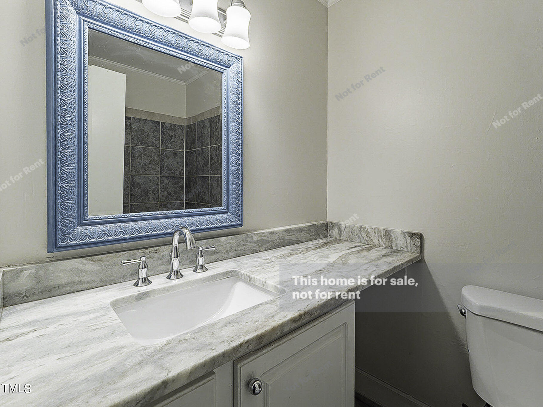 3413 Wade Avenue Raleigh, NC 27607 - Photo 21 of 24 a bathroom with a granite countertop sink a toilet and a mirror