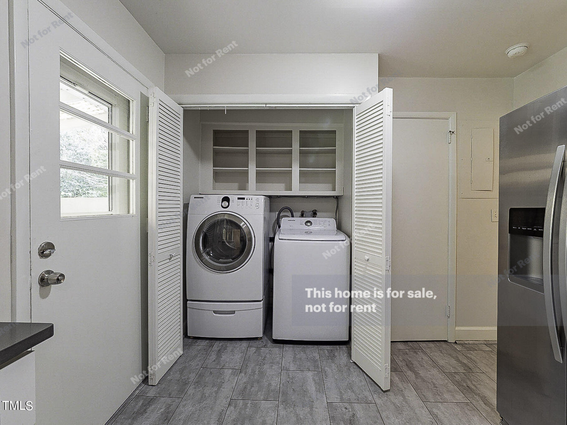 3413 Wade Avenue Raleigh, NC 27607 - Photo 22 of 24 a utility room with fridge dryer and washer