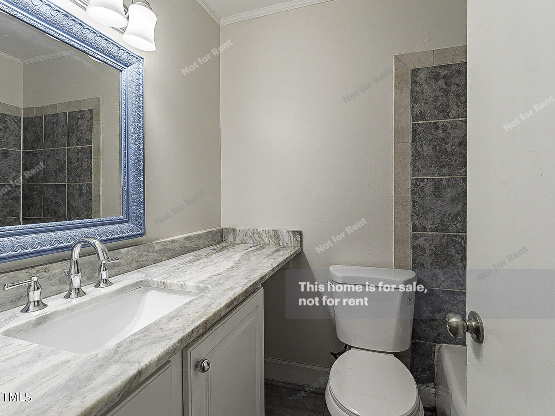 3413 Wade Avenue Raleigh, NC 27607 - Photo 7 of 24 a bathroom with a granite countertop toilet a sink and a mirror