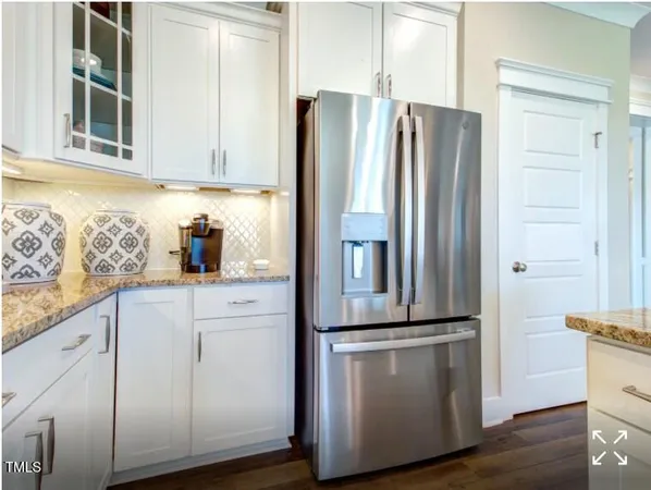 a kitchen with appliances and cabinets