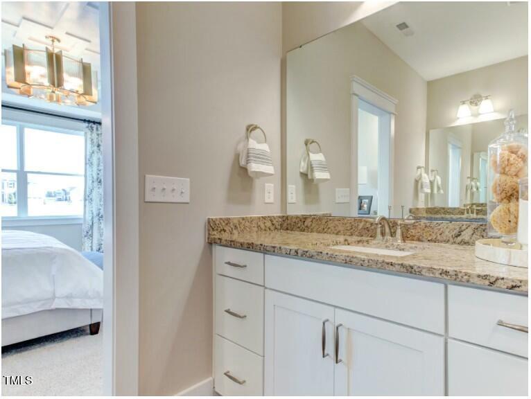 0 Boykin Road Sims, NC 27880 - Photo 24 of 48 a bathroom with a granite countertop sink and a mirror