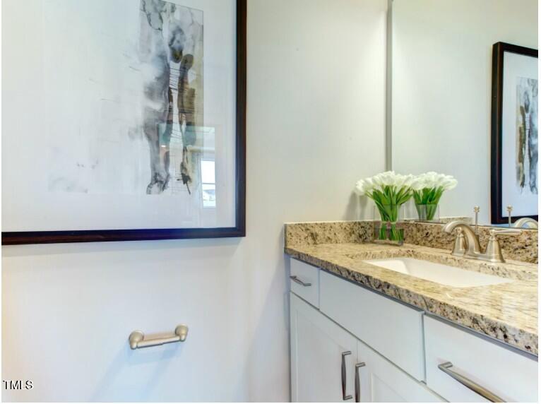 0 Boykin Road Sims, NC 27880 - Photo 25 of 48 a bathroom with a granite countertop sink and a mirror