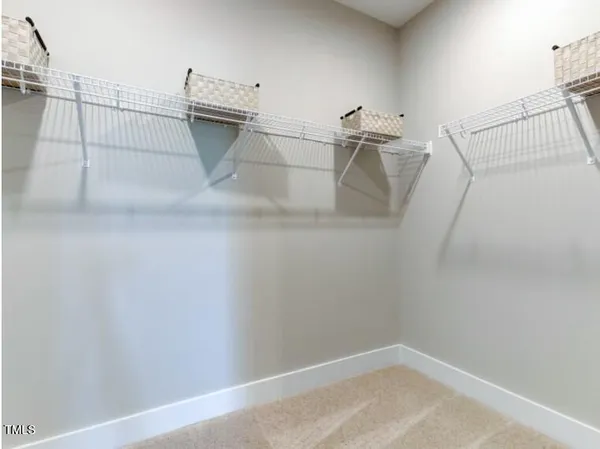a view of a room with racks on the wall