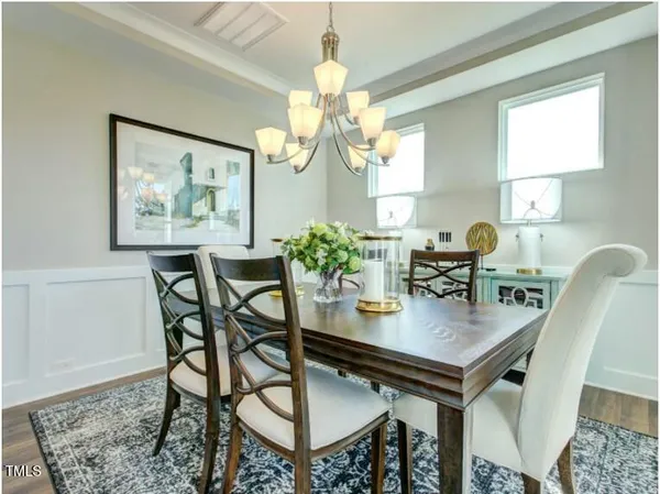 a view of a dining room and chandelier