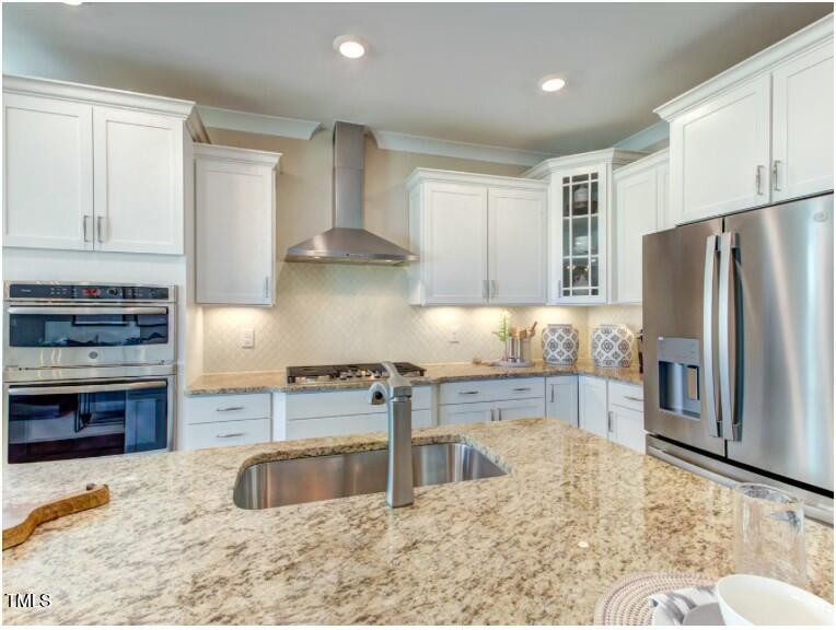 0 Boykin Road Sims, NC 27880 - Photo 10 of 48 a kitchen with stainless steel appliances granite countertop a stove a sink and a refrigerator