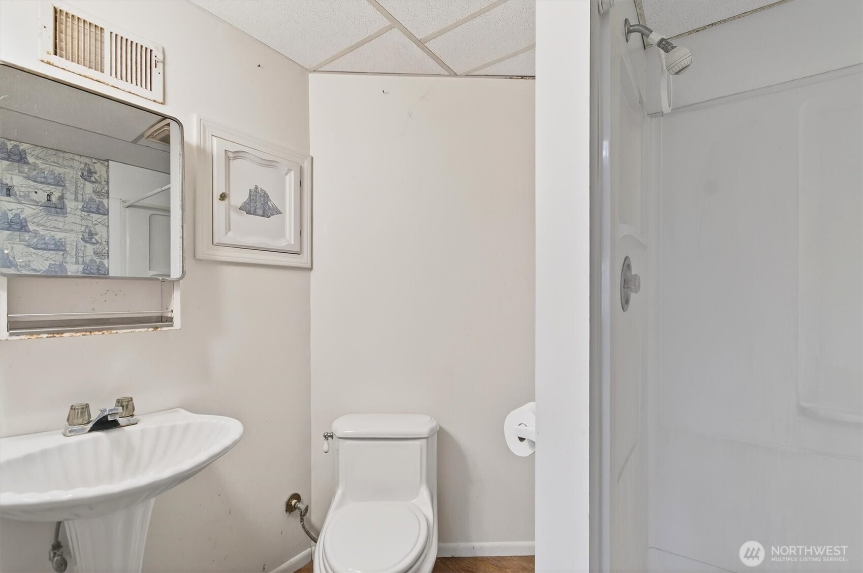 919 Cascade Drive Longview, WA 98632 - Photo 21 of 31 a white toilet sitting next to a bathroom sink
