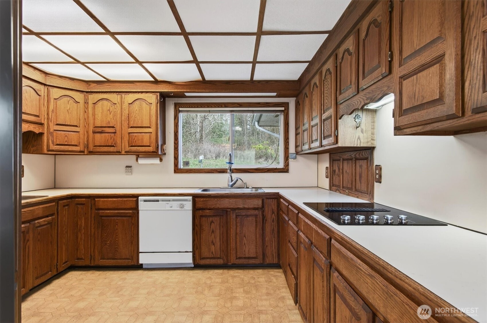 919 Cascade Drive Longview, WA 98632 - Photo 7 of 31 a kitchen with stainless steel appliances granite countertop a stove a sink dishwasher and cabinets with wooden floor