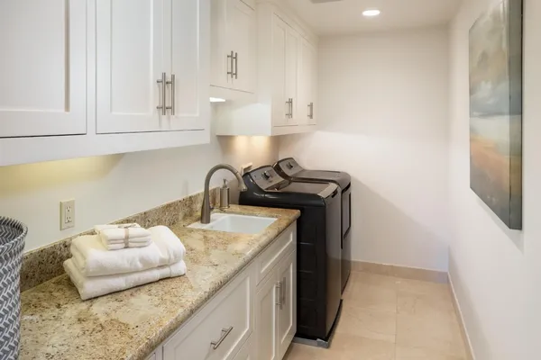 a kitchen with a sink and cabinets