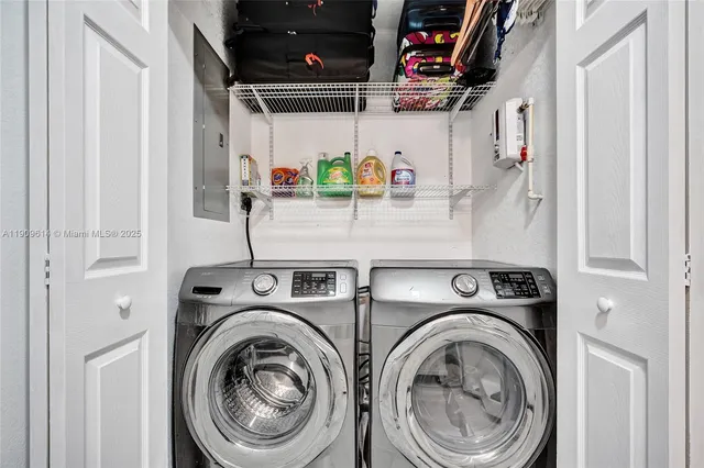 an empty room with wooden floor closet and windows