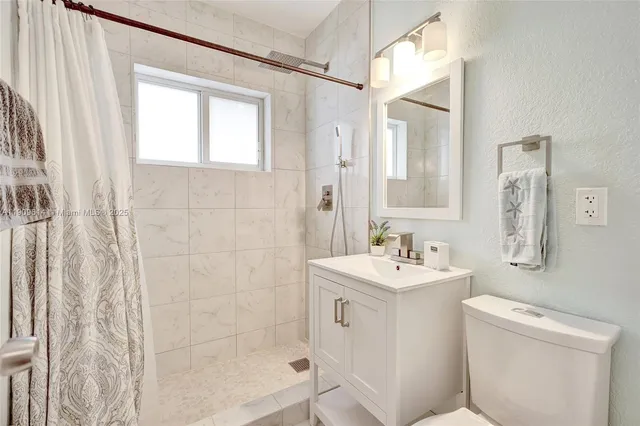 a bedroom with a bed and a table in it