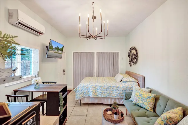 a bathroom with a toilet sink vanity and mirror