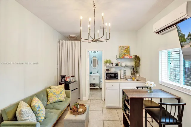 a bathroom with a toilet a sink and a shower curtain