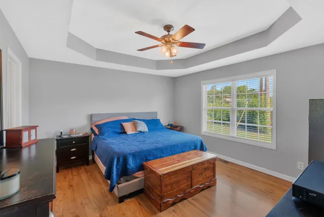 a bedroom with a bed and window