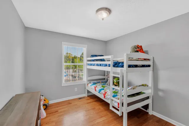 a bed room with a bed and a window