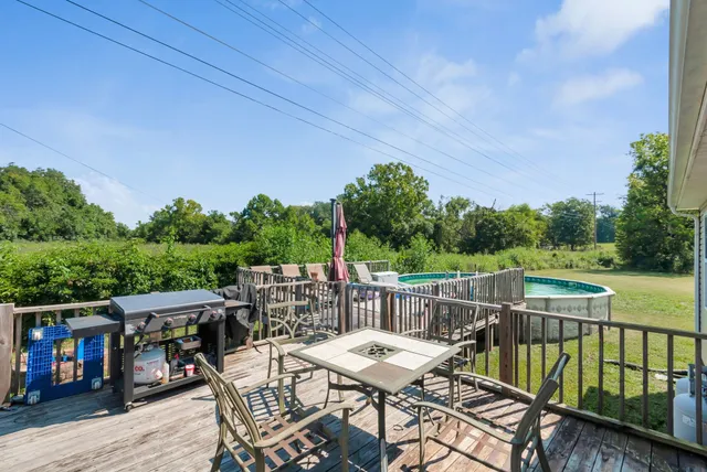 a view of a chairs and table on the deck