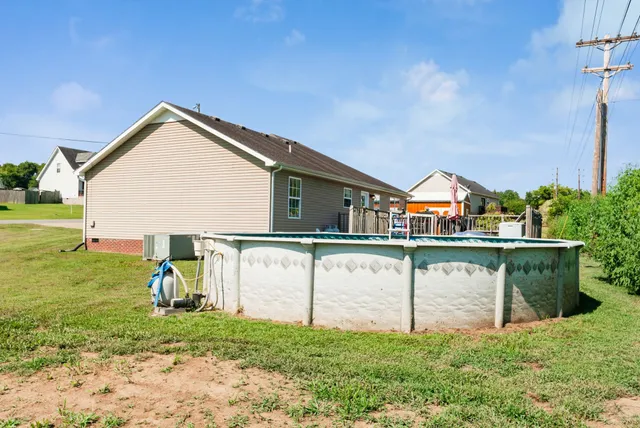 a view of front of house with a yard