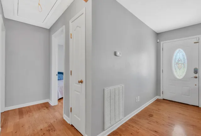 a view of room with wooden floor