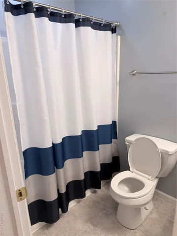a bathroom with a sink toilet and mirror