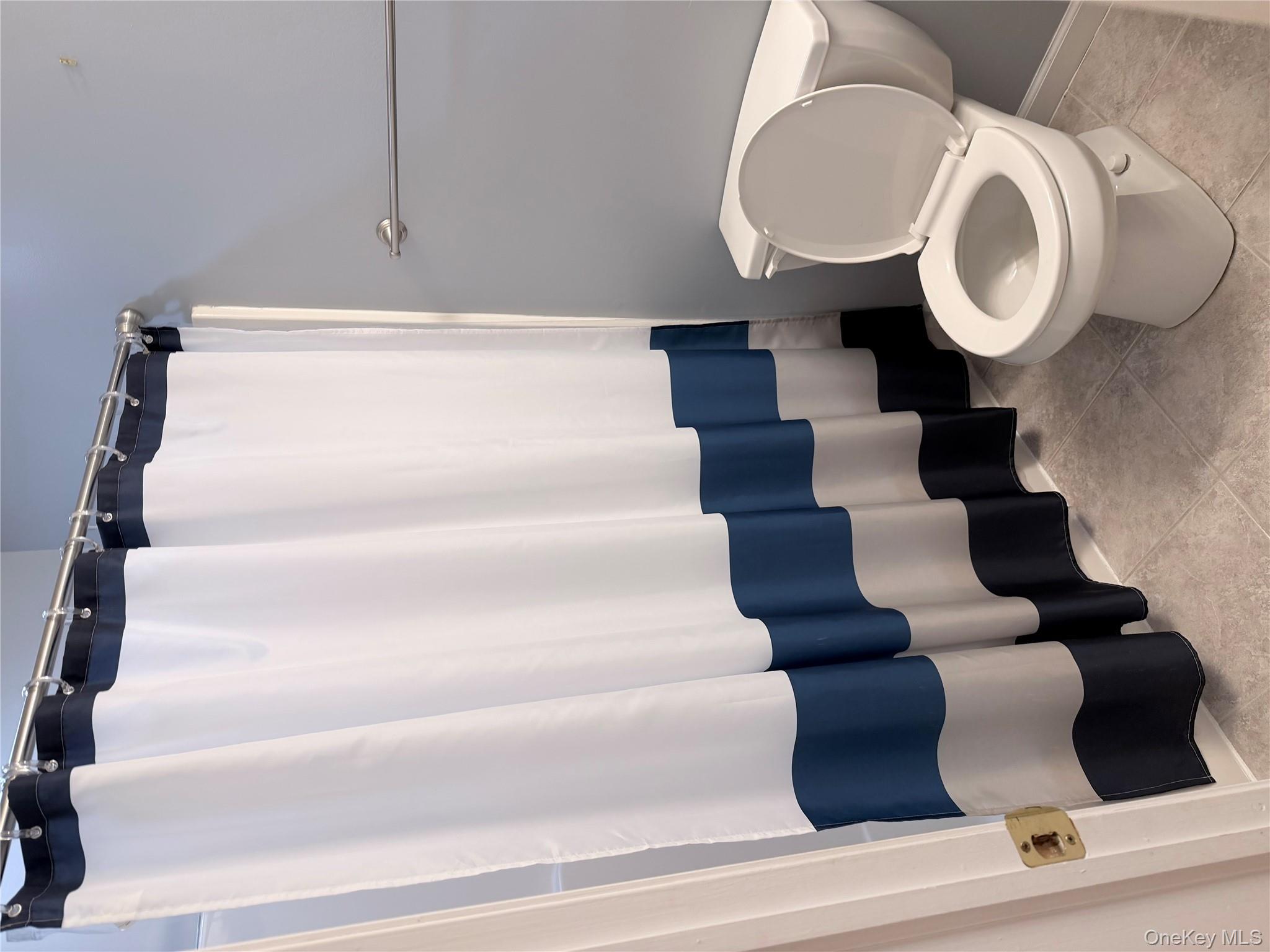 1043 Roosa Gap Road Pine Bush, NY 12566 - Photo 17 of 20 Full bathroom featuring curtained shower and tile patterned floors