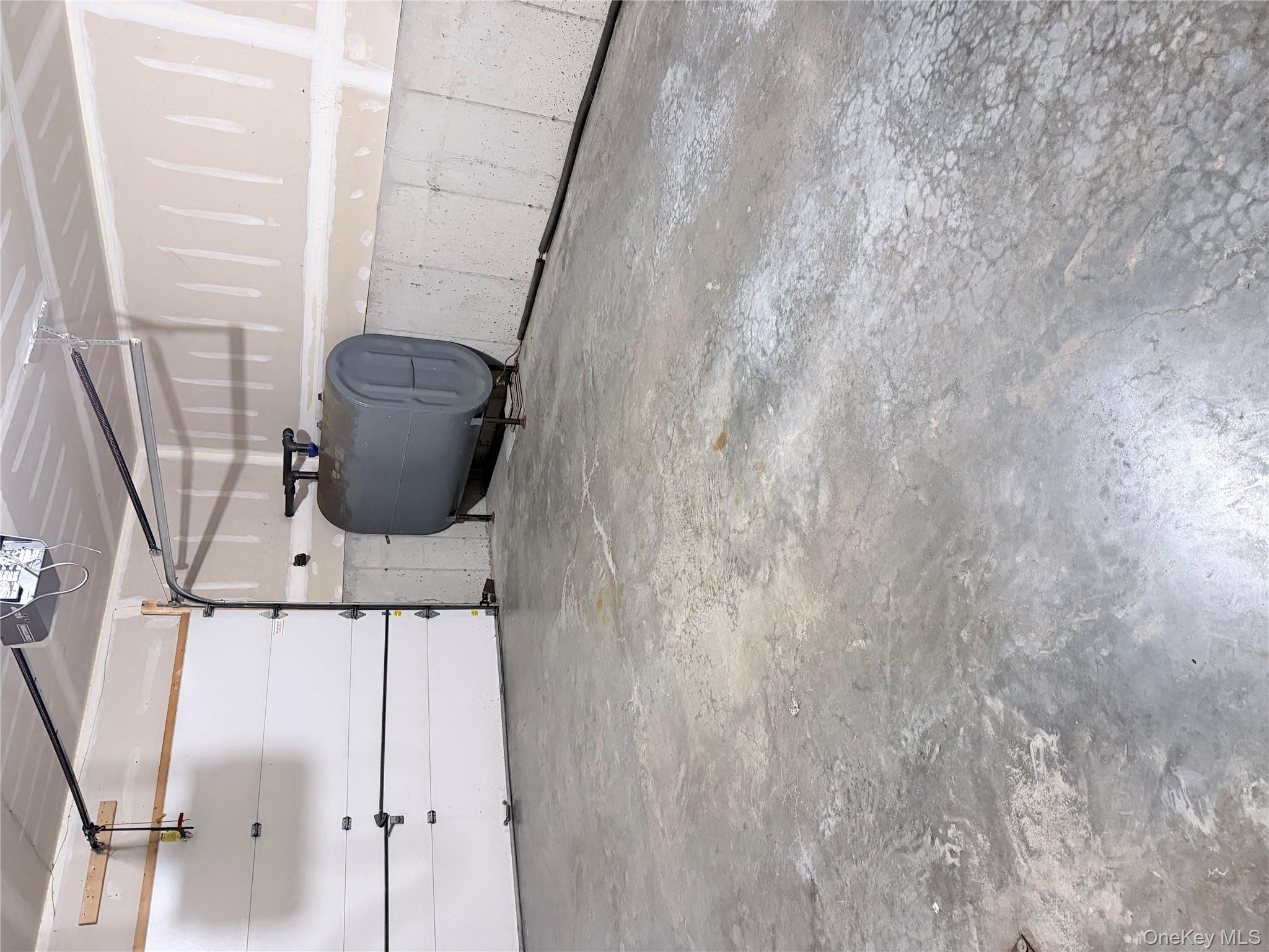 1043 Roosa Gap Road Pine Bush, NY 12566 - Photo 3 of 20 Garage featuring oil tank and a garage door opener