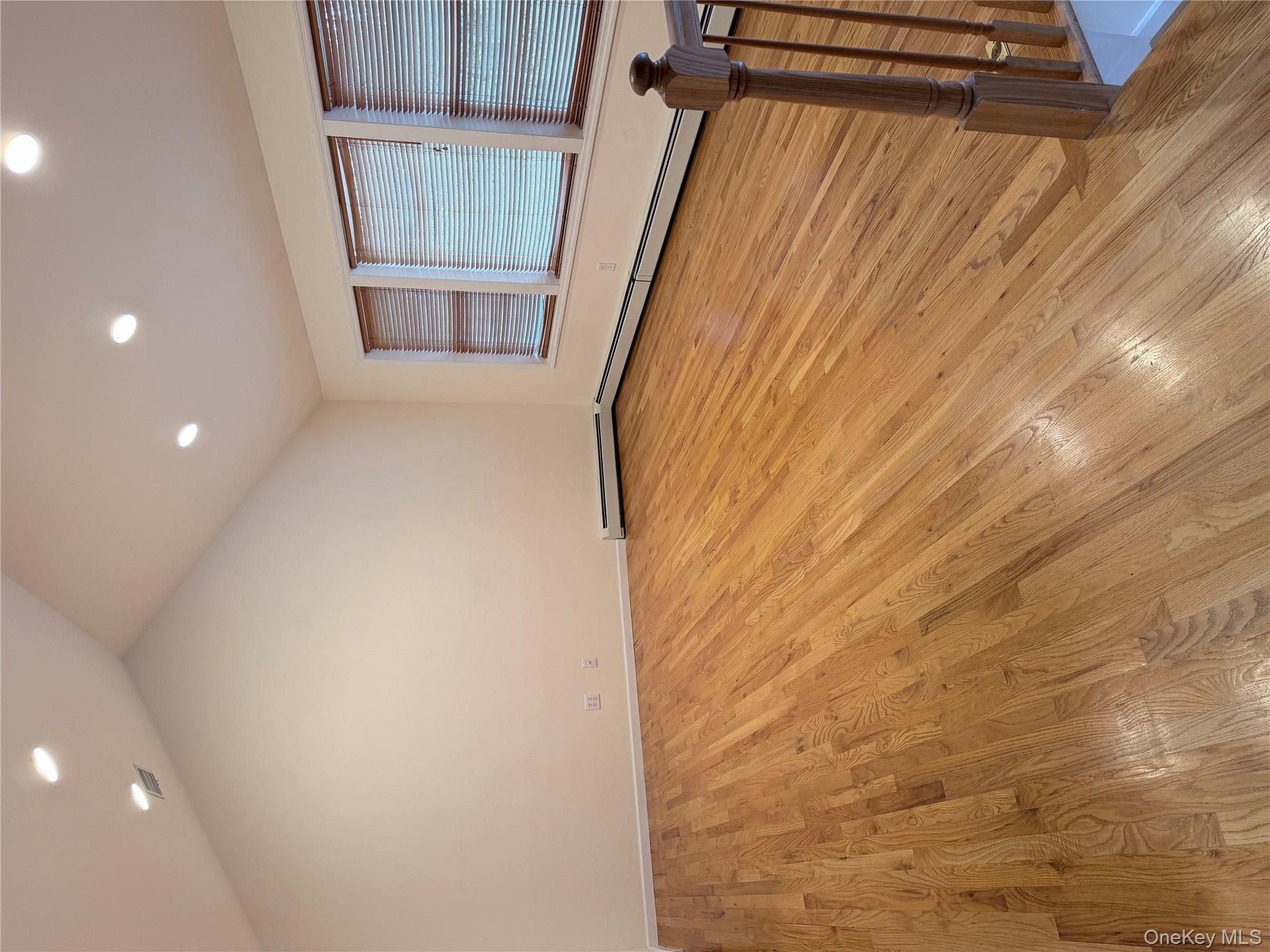 1043 Roosa Gap Road Pine Bush, NY 12566 - Photo 9 of 20 Empty room featuring light wood-style flooring, recessed lighting, and lofted ceiling