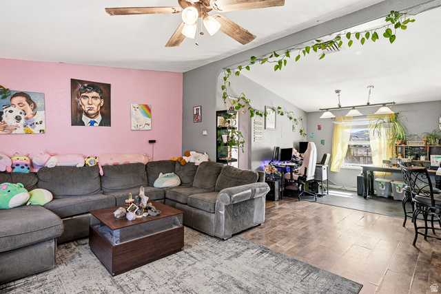 4296 Maple Lane Cedar City, UT 84721 - Photo 6 of 44 Open-concept living area featuring a vaulted ceiling and a wood-finish ceiling fan