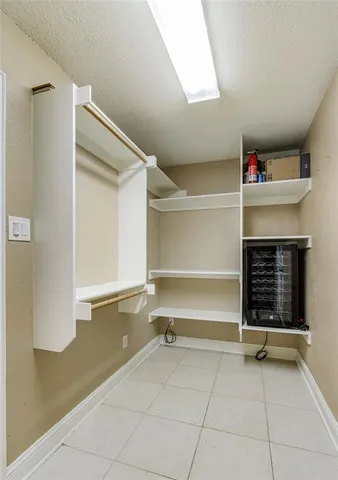 a view of an empty room with a fireplace