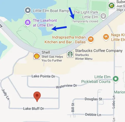 an aerial view of a house with a lake view