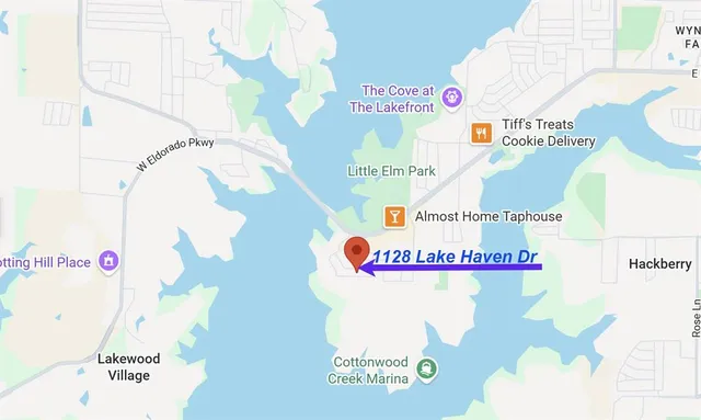 a sign that is sitting next to a white wall