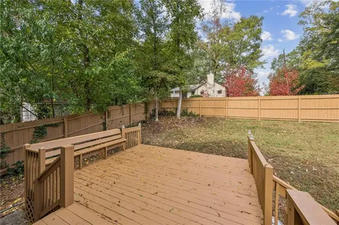 a view of a terrace with wooden floor and fence