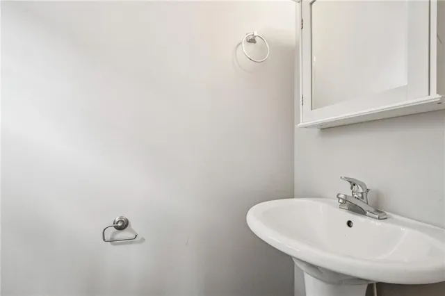 a bathroom with a sink and mirror