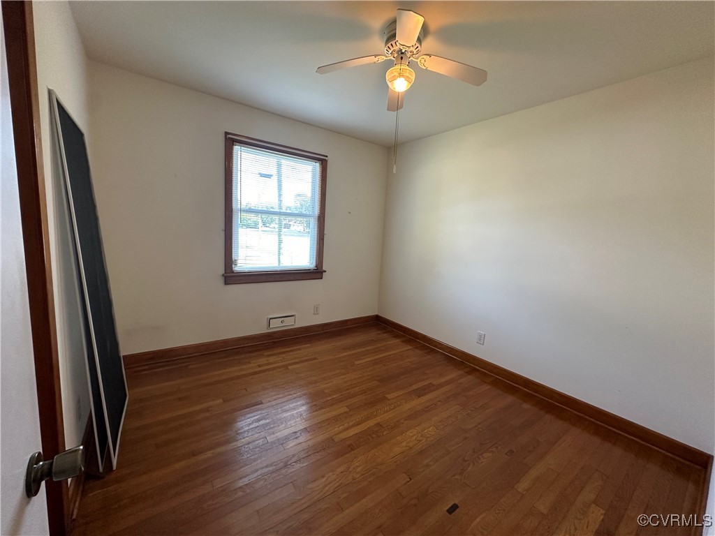 3415 Virginia Street Hopewell, VA 23860 - Photo 15 of 24 an empty room with wooden floor and windows