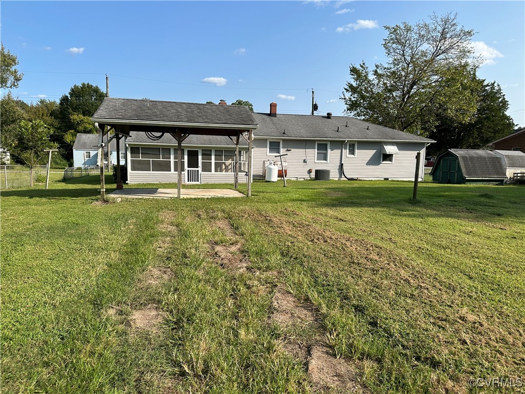 3415 Virginia Street Hopewell, VA 23860 - Photo 22 of 24 a front view of a house with a garden